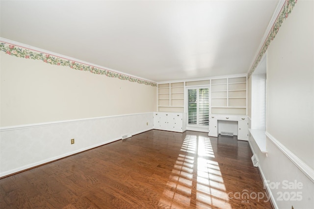 2643 Rolling Hills Dr, Monroe, NC 28110 - empty room featuring built in shelves, dark wood-type flooring, and visible vents