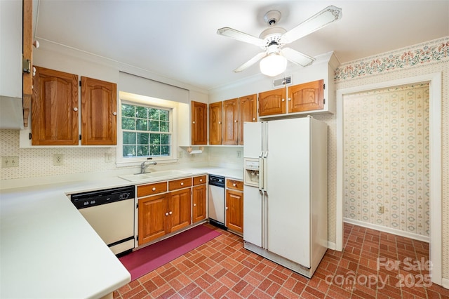 2643 Rolling Hills Dr, Monroe, NC 28110 - kitchen featuring brick patterned floor, visible vents, a ceiling fan, a sink, and white appliances