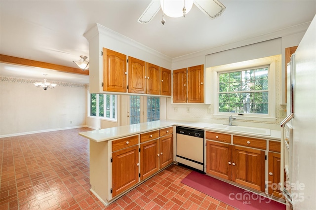 2643 Rolling Hills Dr, Monroe, NC 28110 - kitchen with a peninsula, brick floor, a sink, and white appliances