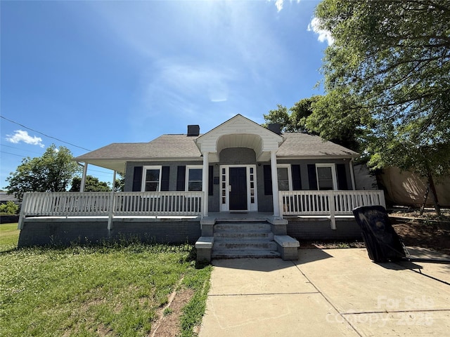 406 S Catawba St, Lancaster, SC 29720 - view of front of house featuring a porch and roof with shingles