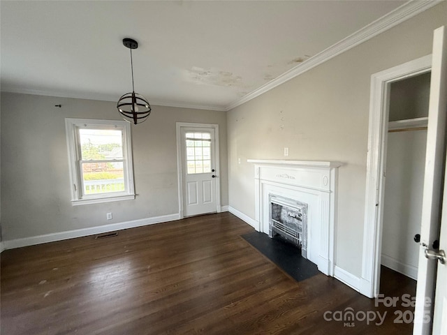 406 S Catawba St, Lancaster, SC 29720 - unfurnished living room featuring a fireplace with flush hearth, crown molding, dark wood finished floors, baseboards, and a chandelier