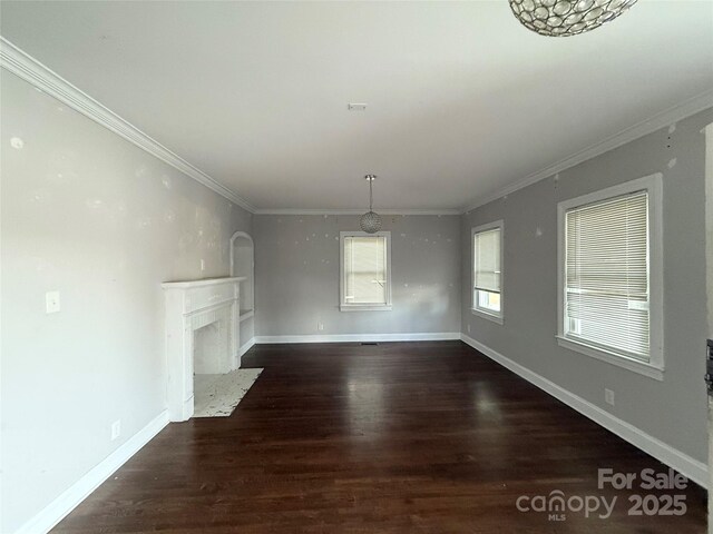 406 S Catawba St, Lancaster, SC 29720 - unfurnished living room with ornamental molding, wood finished floors, a fireplace, and baseboards