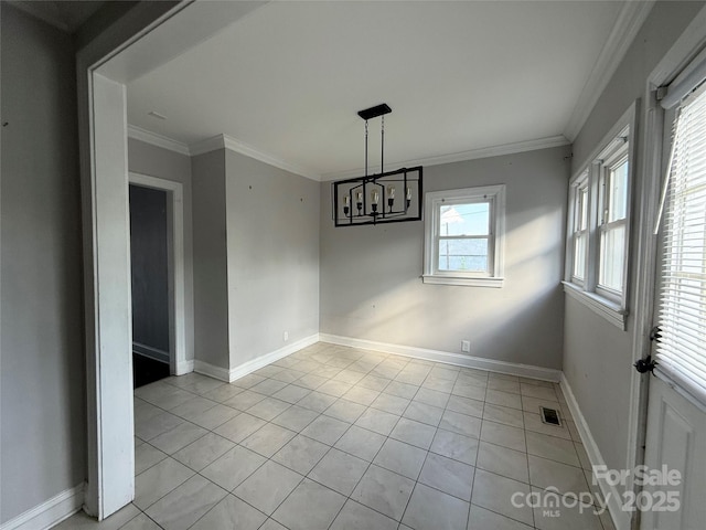 406 S Catawba St, Lancaster, SC 29720 - unfurnished dining area with crown molding, a chandelier, light tile patterned floors, and baseboards