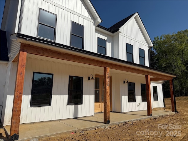 view of front of house with board and batten siding and covered porch