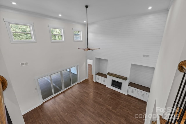 4034 Daugherty Rd, China Grove, NC 28023 - unfurnished living room featuring wood finished floors, recessed lighting, a high ceiling, a ceiling fan, and a fireplace