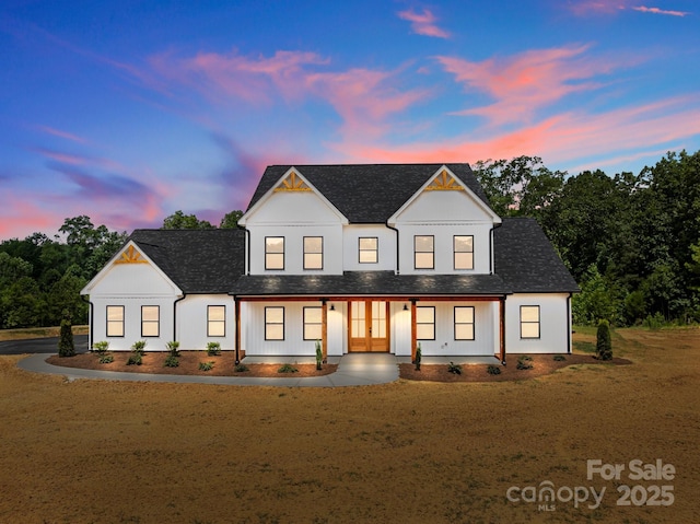 4034 Daugherty Rd, China Grove, NC 28023 - modern farmhouse featuring french doors, roof with shingles, board and batten siding, and a porch