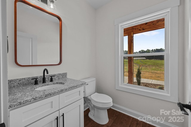 4034 Daugherty Rd, China Grove, NC 28023 - half bathroom featuring vanity and wood finished floors