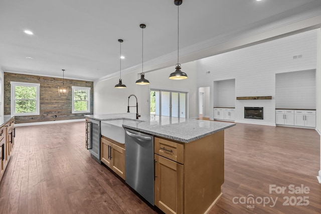 4034 Daugherty Rd, China Grove, NC 28023 - kitchen featuring stainless steel dishwasher, open floor plan, ornamental molding, a fireplace, and light stone counters