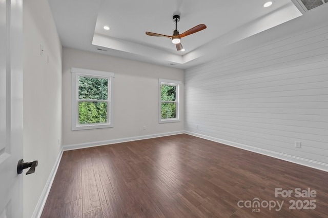 4034 Daugherty Rd, China Grove, NC 28023 - spare room with a tray ceiling, ceiling fan, dark wood-style floors, and recessed lighting