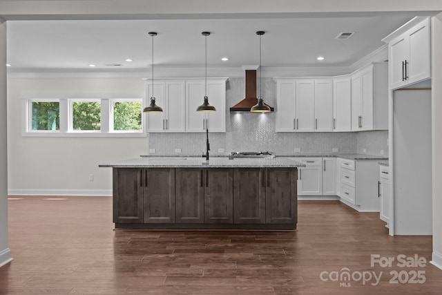 4040 Daugherty Rd, China Grove, NC 28023 - kitchen with wall chimney exhaust hood, white cabinets, light stone countertops, backsplash, and recessed lighting