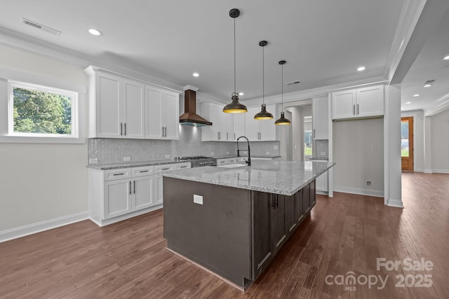 4040 Daugherty Rd, China Grove, NC 28023 - kitchen featuring wall chimney range hood, white cabinetry, tasteful backsplash, dark wood finished floors, and recessed lighting