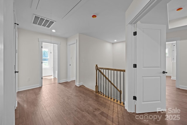 4040 Daugherty Rd, China Grove, NC 28023 - hallway featuring an upstairs landing, attic access, and wood finished floors