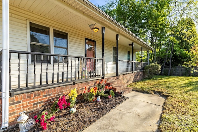 304 W Fourth St, Cherryville, NC 28021 - property entrance with a lawn, covered porch, and fence