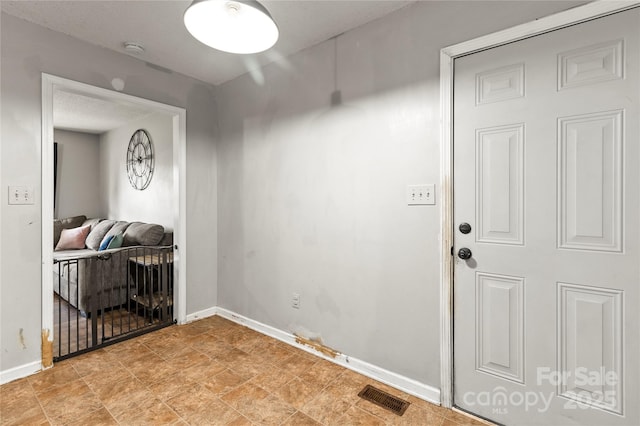 304 W Fourth St, Cherryville, NC 28021 - entryway featuring baseboards and visible vents