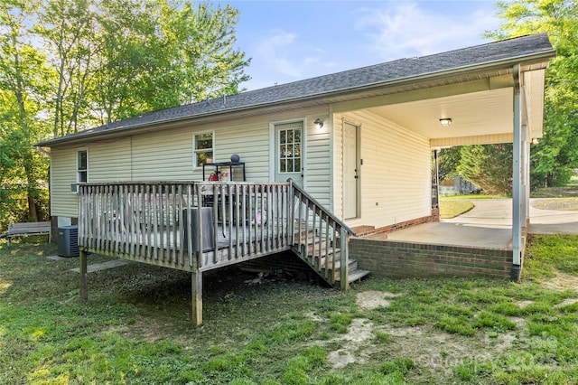 304 W Fourth St, Cherryville, NC 28021 - rear view of property featuring a wooden deck, roof with shingles, and central air condition unit