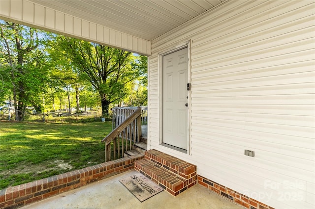304 W Fourth St, Cherryville, NC 28021 - doorway to property featuring a lawn, crawl space, and fence