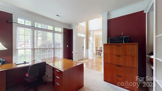 home office with decorative columns, visible vents, carpet, and crown molding