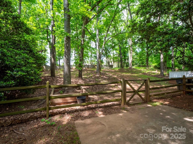 view of gate with fence
