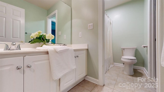 full bath with a sink, toilet, double vanity, baseboards, and tile patterned flooring