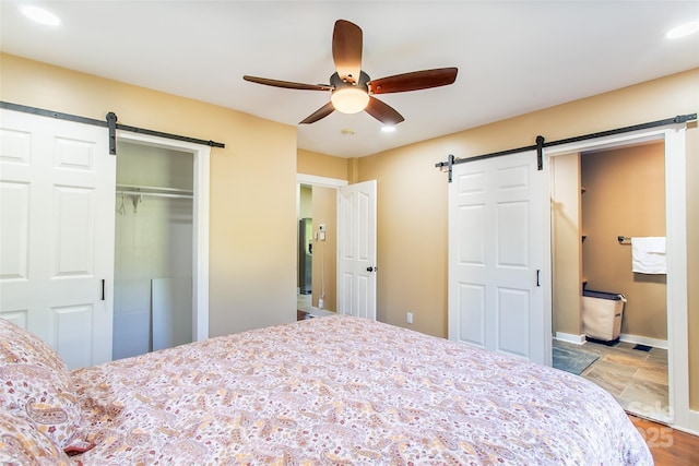 115 Cold Springs Dr, Mill Spring, NC 28756 - bedroom with a barn door, recessed lighting, a closet, baseboards, and a ceiling fan