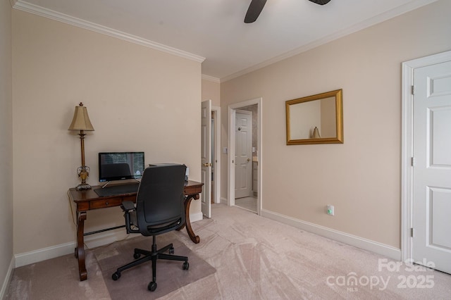 office area featuring light colored carpet, crown molding, baseboards, and ceiling fan