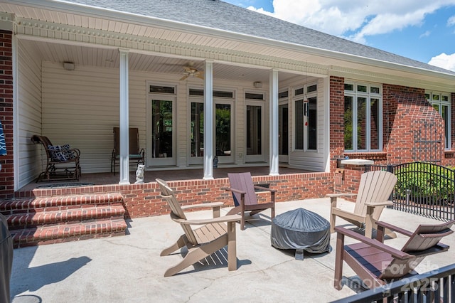 view of patio featuring an outdoor fire pit and ceiling fan