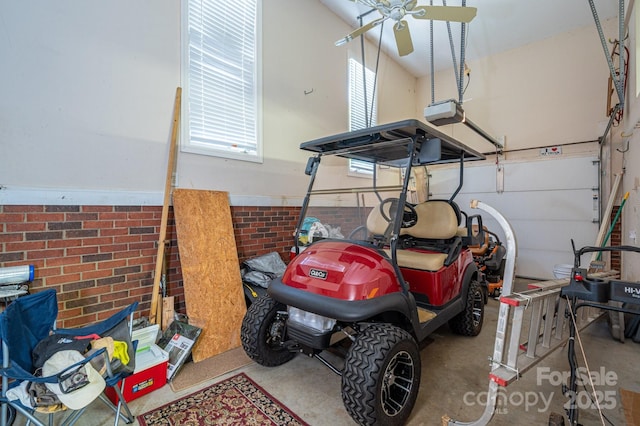 garage with ceiling fan and a garage door opener