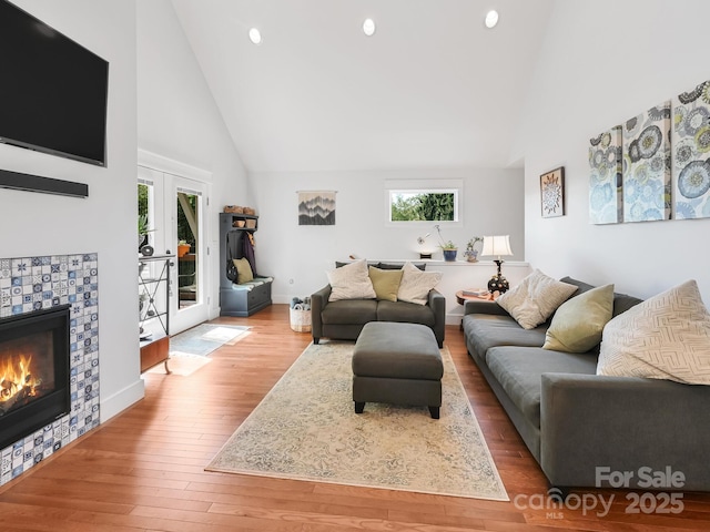 18 Covington St, Asheville, NC 28806 - living area with french doors, wood finished floors, high vaulted ceiling, and recessed lighting