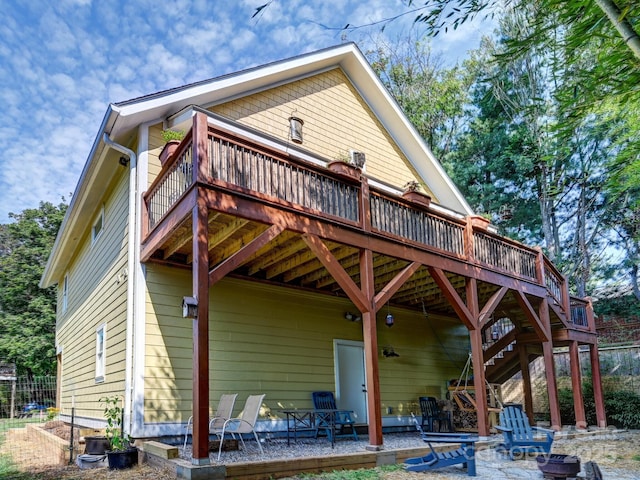 18 Covington St, Asheville, NC 28806 - rear view of property featuring a fire pit, stairway, a deck, and a patio