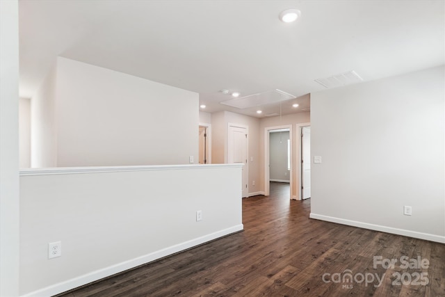 13210 Kenworth Rd, Charlotte, NC 28278 - unfurnished room featuring attic access, recessed lighting, dark wood-style flooring, and a smoke detector