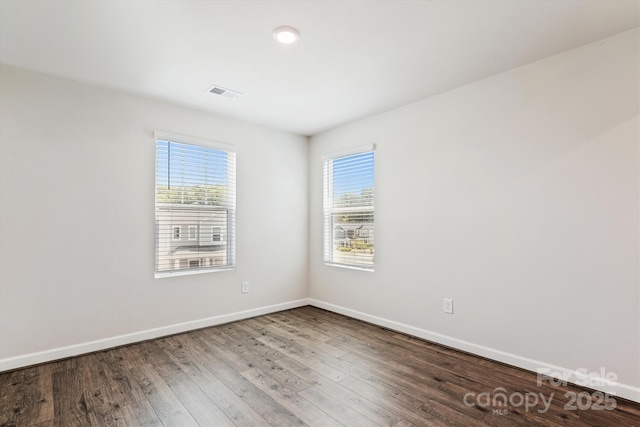 13210 Kenworth Rd, Charlotte, NC 28278 - empty room featuring plenty of natural light and wood finished floors