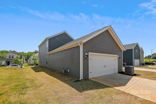 13210 Kenworth Rd, Charlotte, NC 28278 - view of side of home featuring a lawn, a garage, and driveway