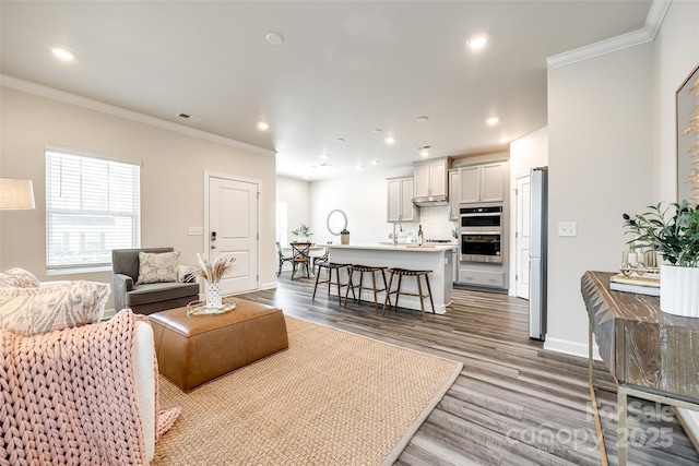 13210 Kenworth Rd, Charlotte, NC 28278 - living area with ornamental molding, wood finished floors, and recessed lighting
