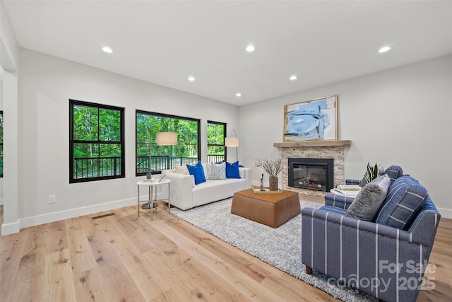 1 Linestowe Dr, Belmont, NC 28012 - living area with baseboards, a stone fireplace, wood finished floors, and recessed lighting