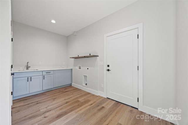 1 Linestowe Dr, Belmont, NC 28012 - laundry room with light wood finished floors, a sink, hookup for an electric dryer, hookup for a washing machine, and cabinet space