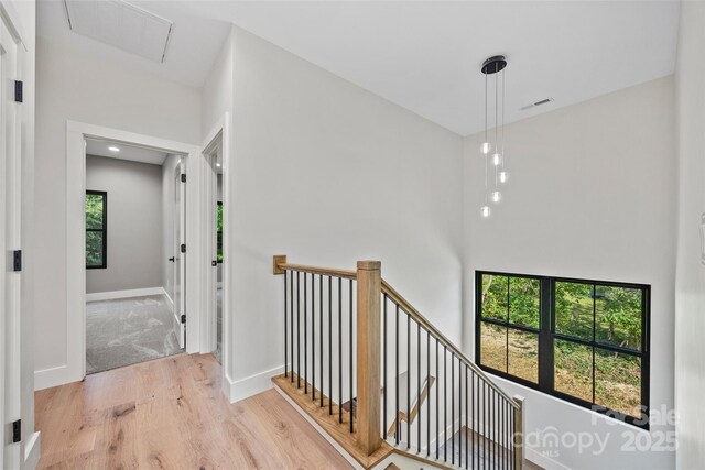 1 Linestowe Dr, Belmont, NC 28012 - corridor with wood finished floors, visible vents, baseboards, and an upstairs landing