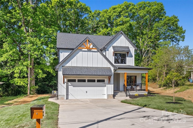 1 Linestowe Dr, Belmont, NC 28012 - modern inspired farmhouse with a shingled roof, a front lawn, concrete driveway, board and batten siding, and covered porch