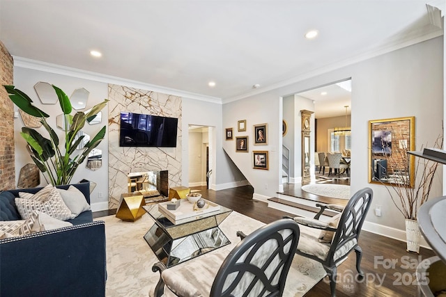 423 N Pine St, Charlotte, NC 28202 - living room featuring baseboards, ornamental molding, a fireplace, and recessed lighting