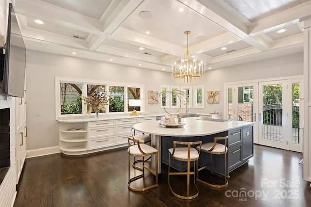 423 N Pine St, Charlotte, NC 28202 - dining room featuring beamed ceiling, coffered ceiling, dark wood-type flooring, and visible vents