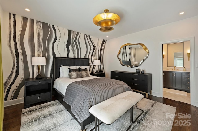 423 N Pine St, Charlotte, NC 28202 - bedroom featuring dark wood-type flooring, connected bathroom, baseboards, and recessed lighting