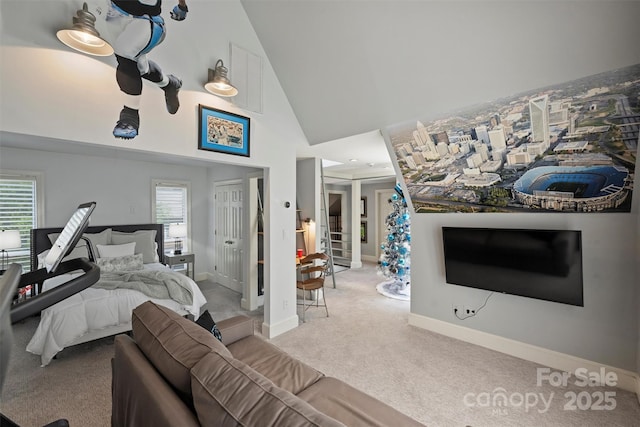 423 N Pine St, Charlotte, NC 28202 - bedroom with high vaulted ceiling, multiple windows, carpet flooring, and visible vents