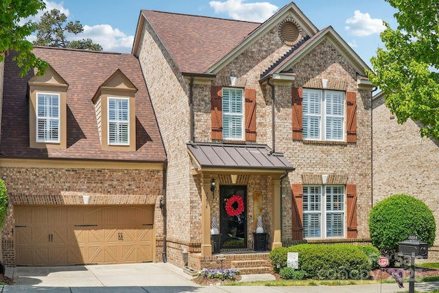 view of front of home with an attached garage, brick siding, driveway, and a shingled roof