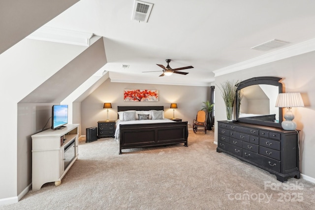 carpeted bedroom featuring baseboards, visible vents, ceiling fan, and crown molding