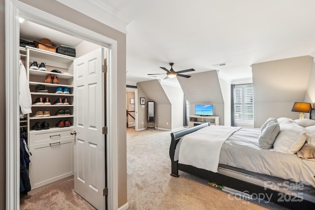bedroom with light colored carpet, crown molding, and visible vents