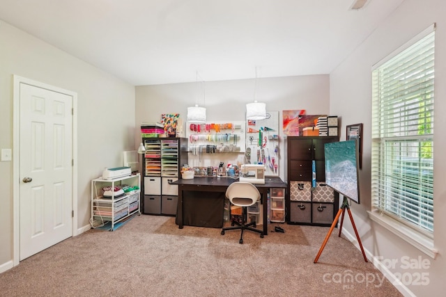 home office featuring baseboards and carpet