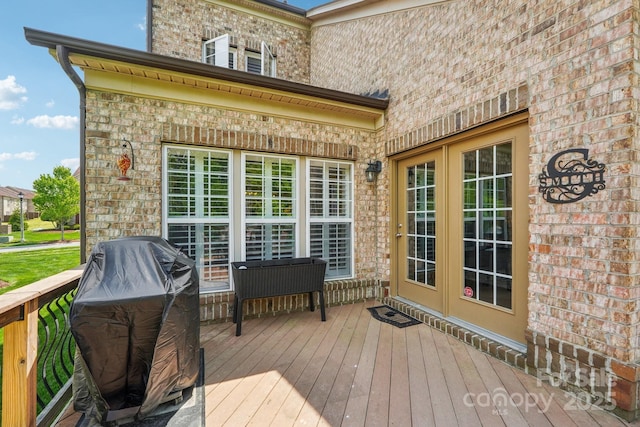 deck featuring a grill