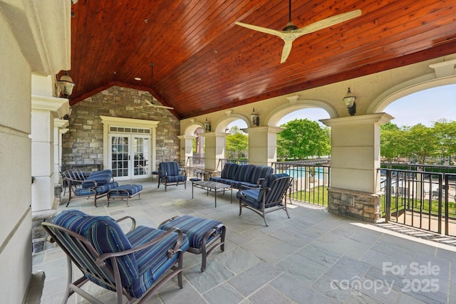 view of patio featuring an outdoor hangout area, a ceiling fan, and french doors