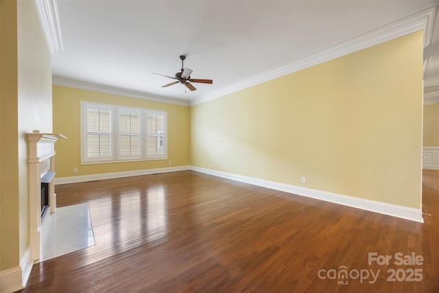 unfurnished living room with wood finished floors, a fireplace, ceiling fan, and crown molding