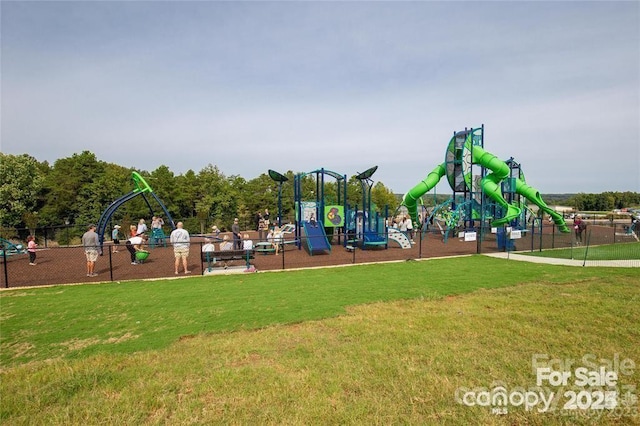 community jungle gym with a lawn and fence