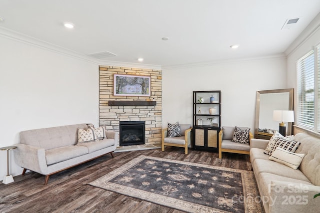 15108 Autumn Sage Dr, Charlotte, NC 28278 - living area featuring wood finished floors, ornamental molding, a stone fireplace, and recessed lighting